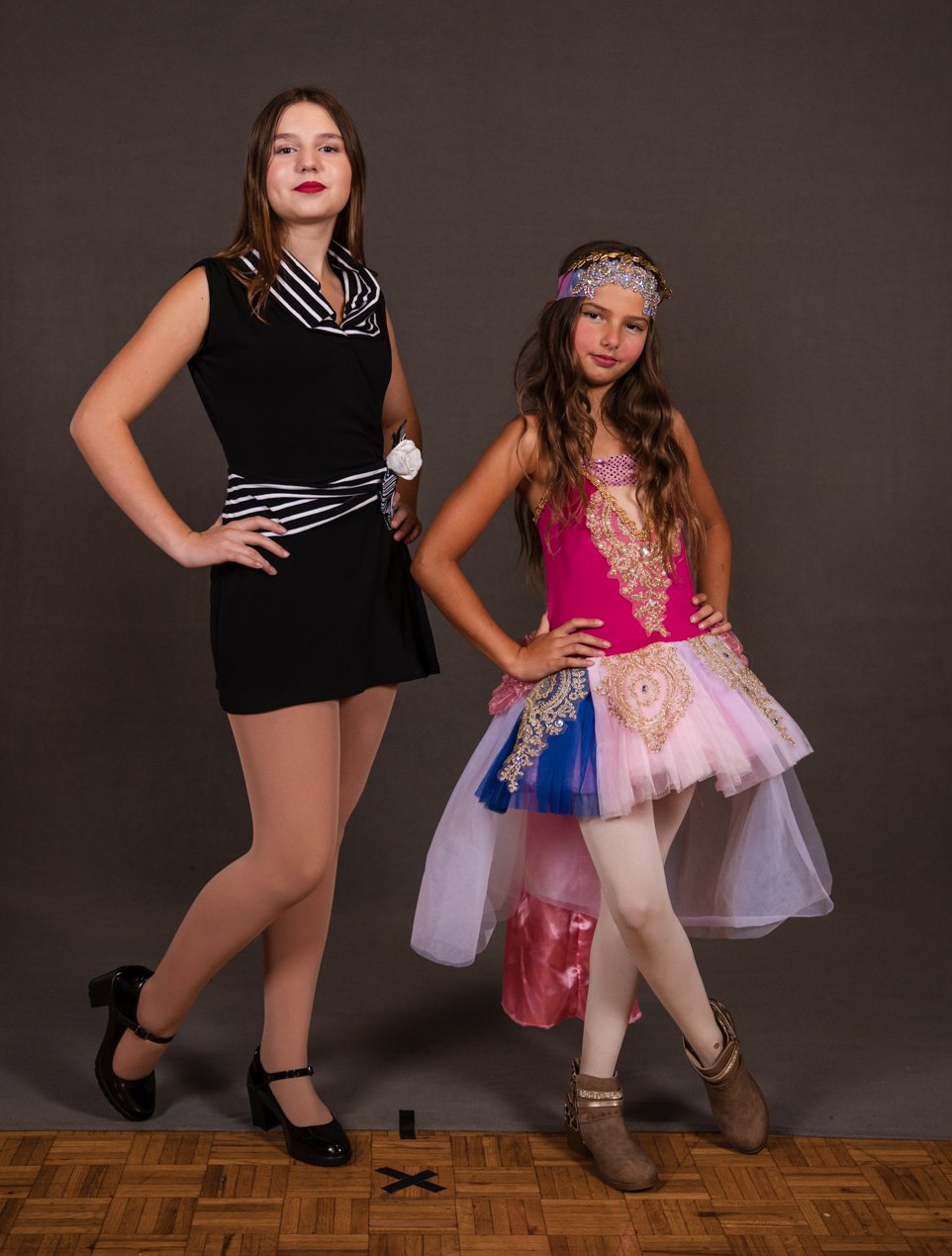Two dancers with hands on hips