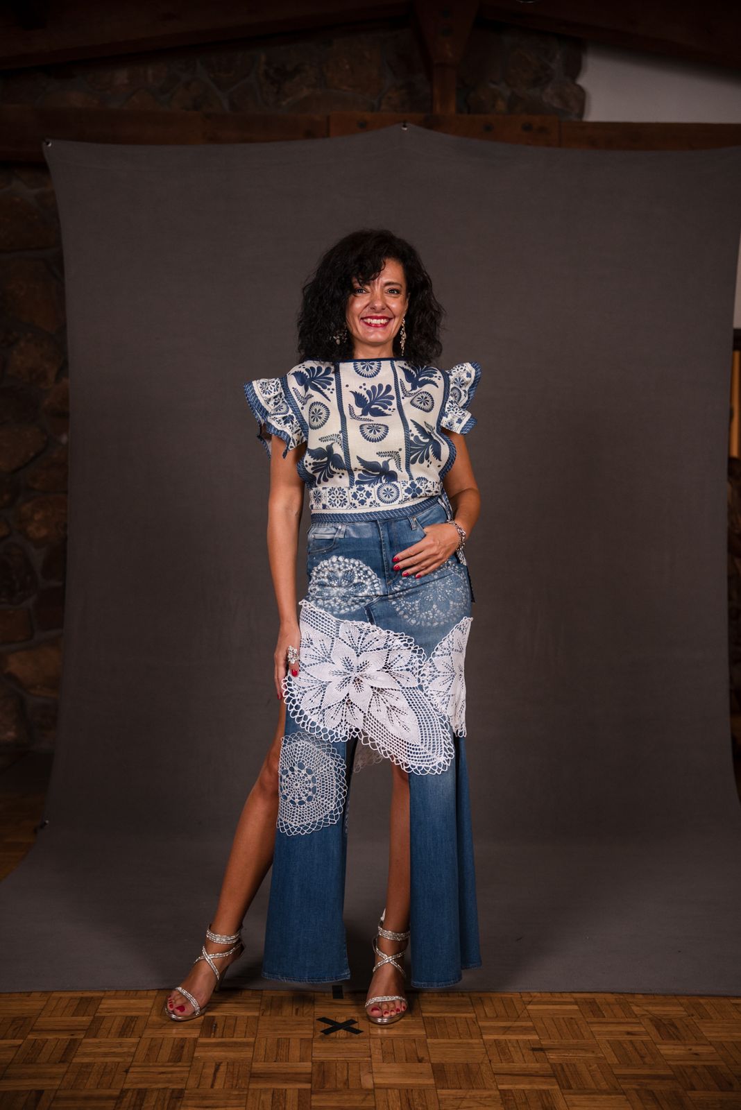 Model in a ruffled denim and lace look