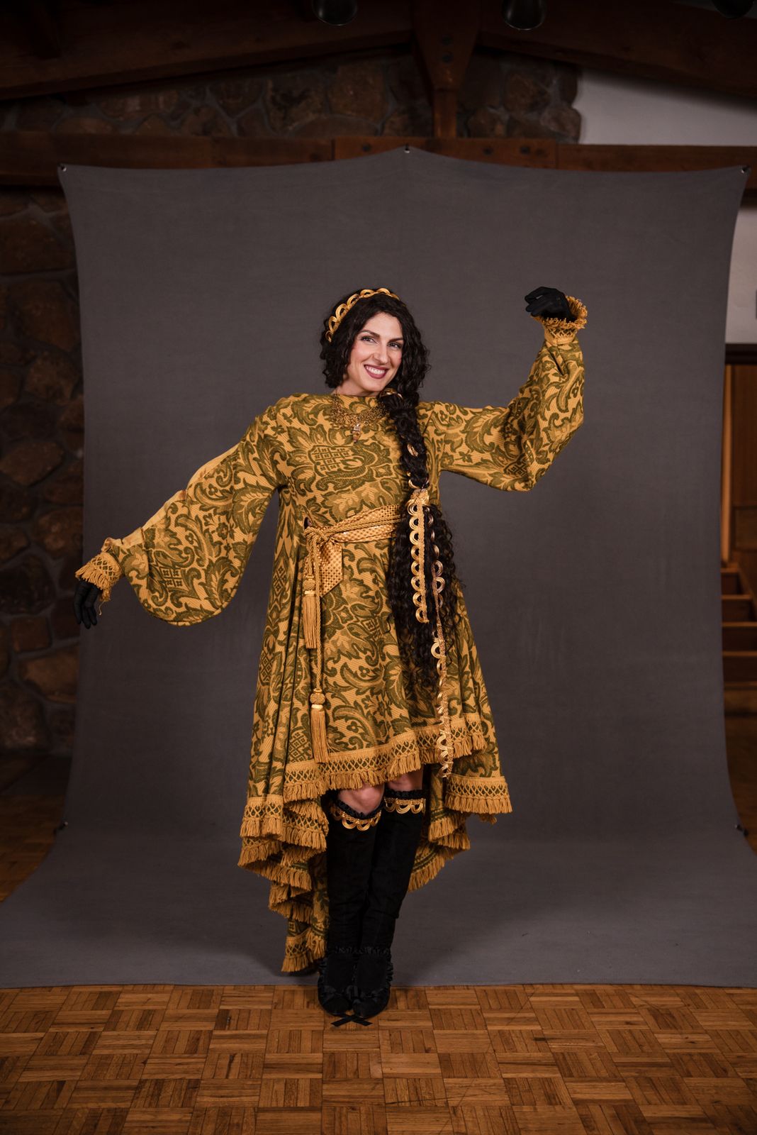 Model in a gold patterned kaftan