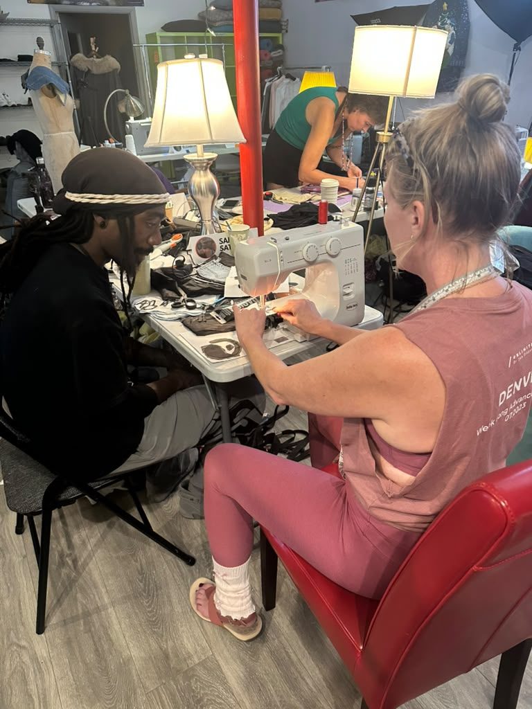 Designers sewing late under studio lights
