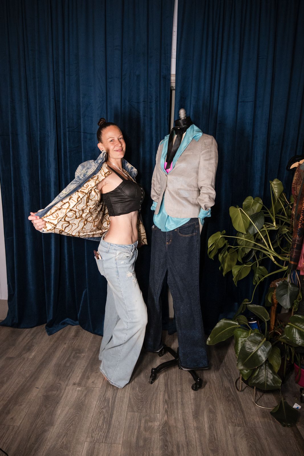 Designer presenting a finished jacket on a model