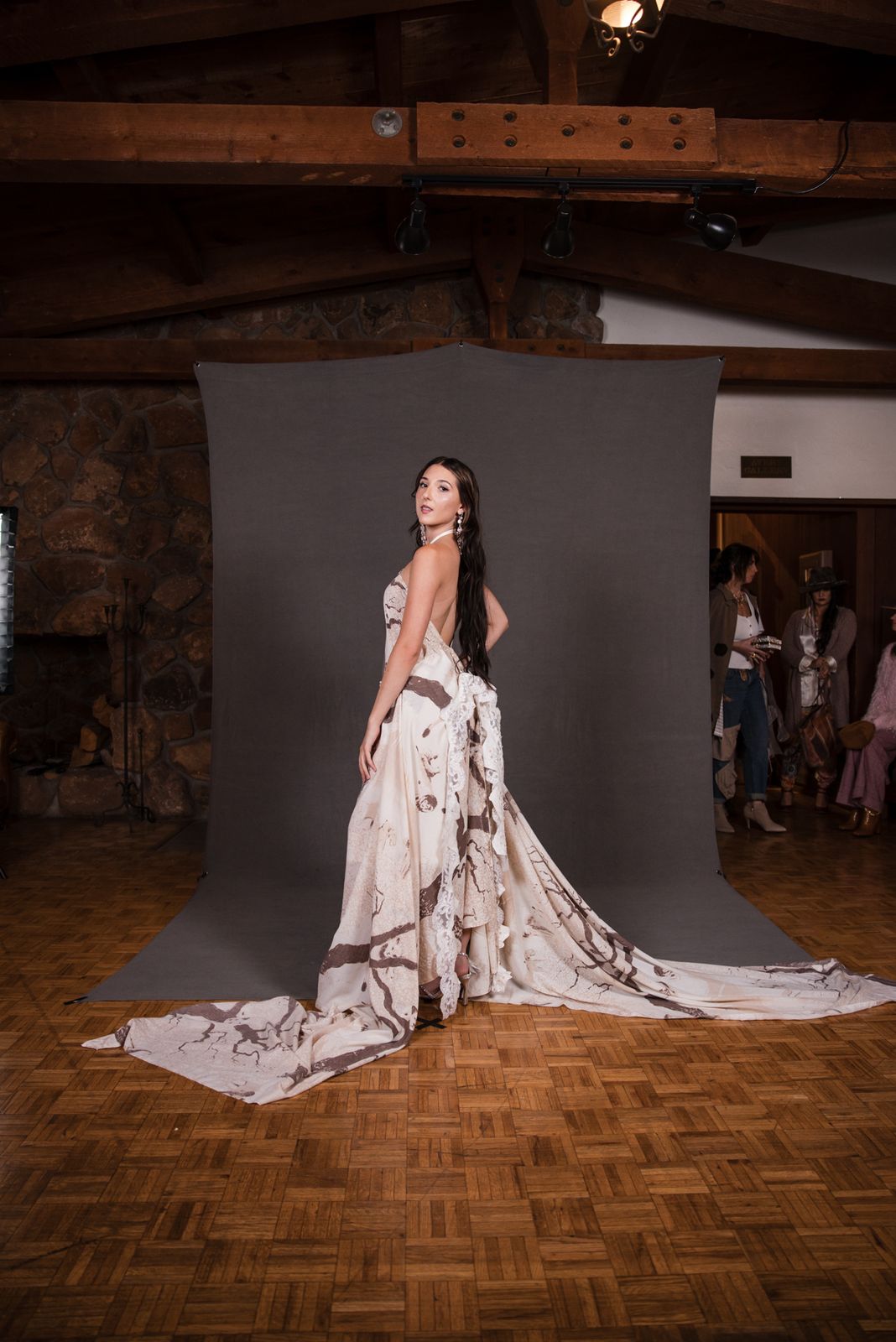 Model in a white gown with a long train