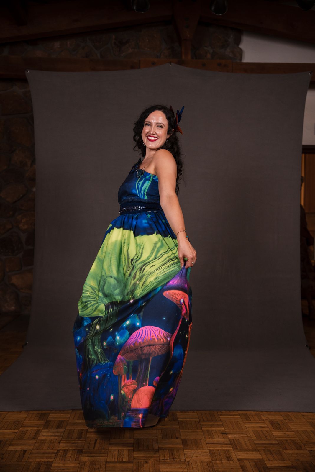Model in a hand-dyed gown printed with glowing mushrooms