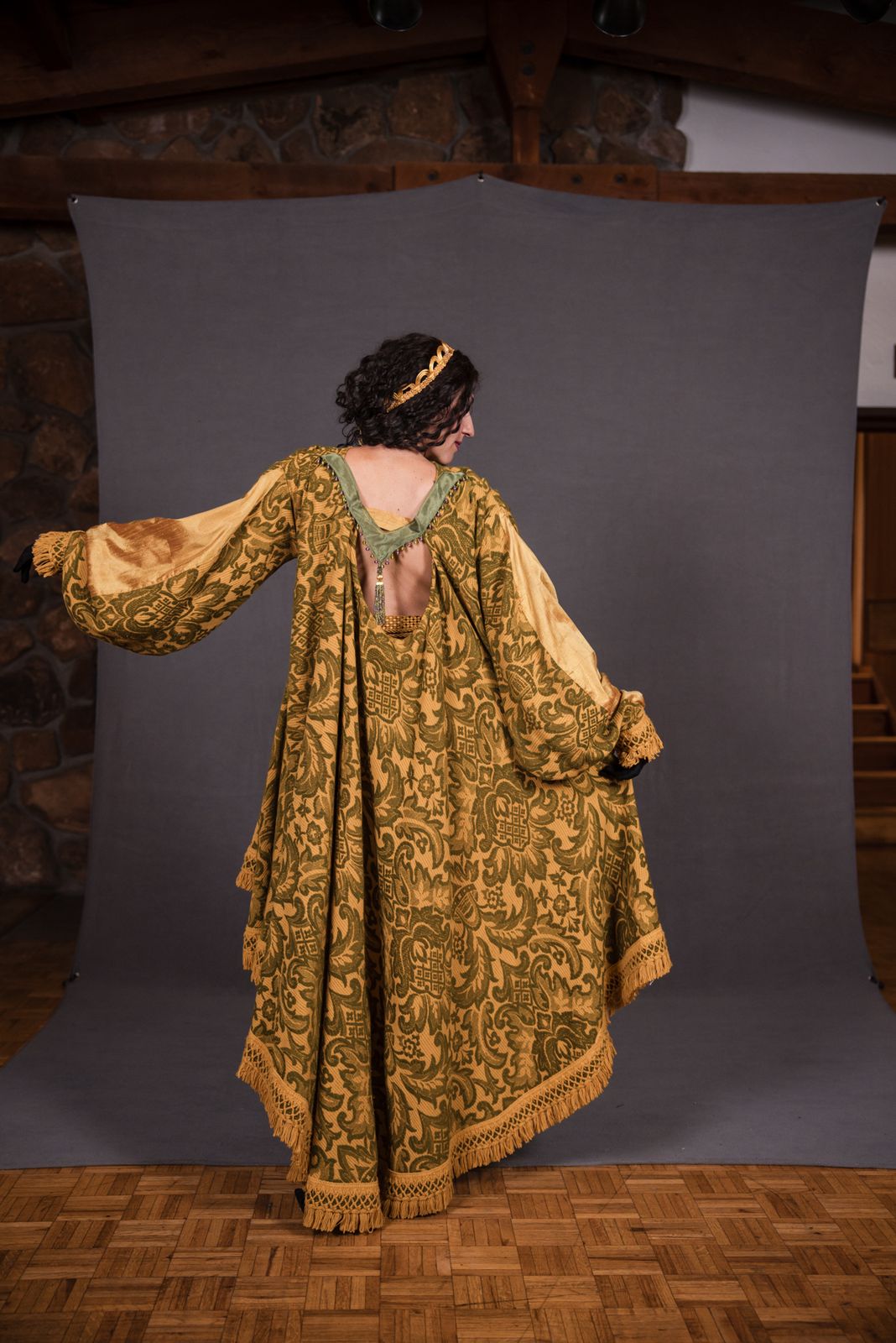 Model in a gold sequin cape