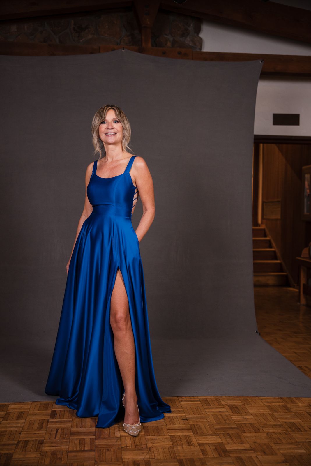 Model in a royal blue satin gown